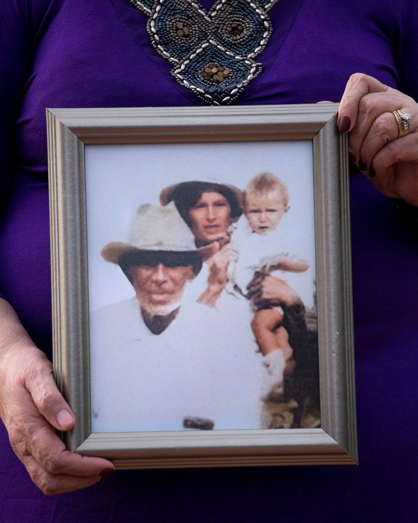 Arlinda Valencia, 68, holds a photograph taken in 1918 of her great-grandfather Longino Flores, left, great-grandmother Ju...